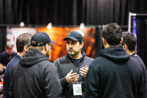 Chimney sweep professionals networking at industry event