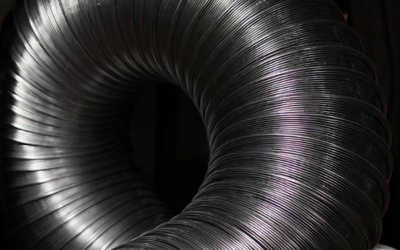 Stainless steel chimney liner being installed